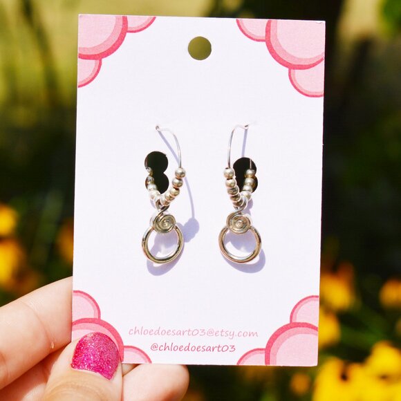 Minimalist Silver Spiral Hoop Earrings - Picture 2 of 6